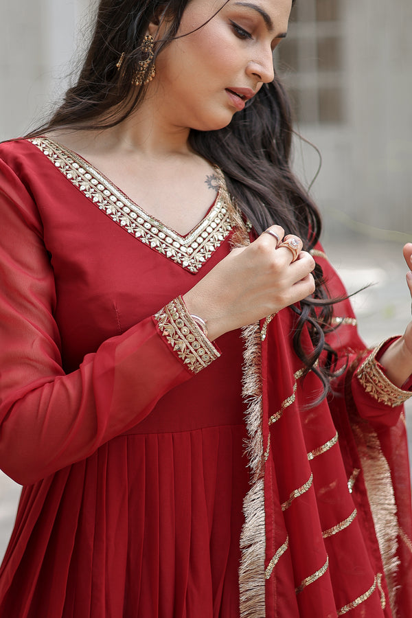 Maroon Faux Blooming Gown with Dupatta With Attractive Embroidered Sequins work with Lace Border.