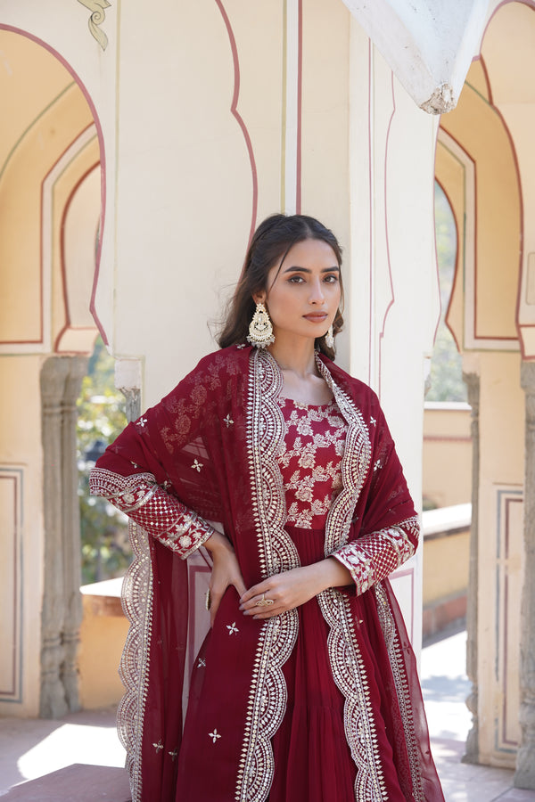 Maroon Faux Blooming gown with Viscose Dyable Jacquard With Sequins Embroidered Work Faux Blooming Dupatta, it will enhance can combine the best parts of western and Indian wear into one stunning ensemble.