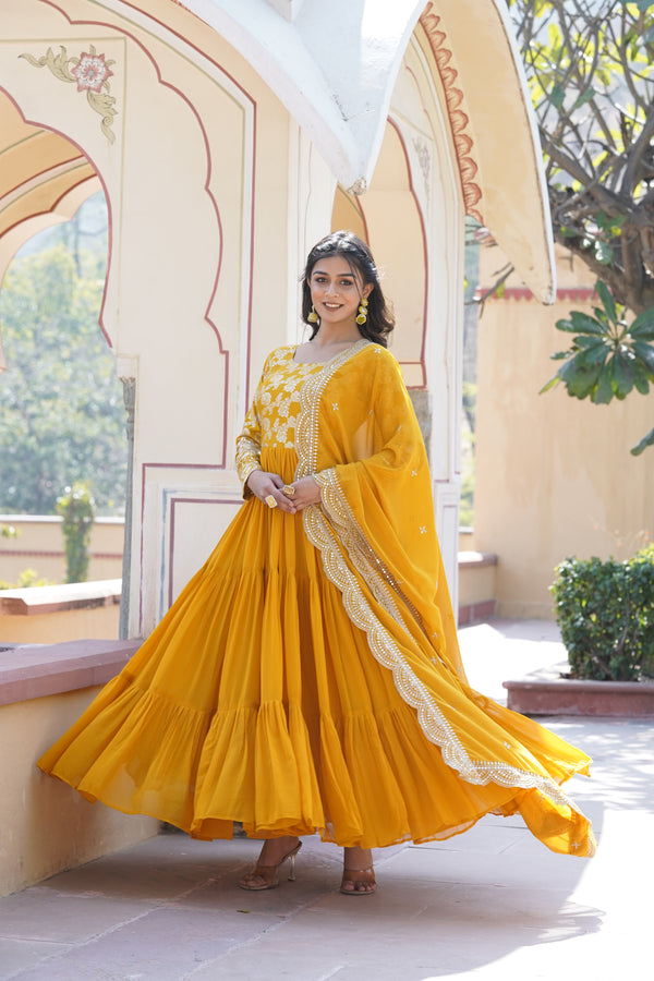 Yellow Faux Blooming gown with Viscose Dyable Jacquard With Sequins Embroidered Work Faux Blooming Dupatta, it will enhance can combine the best parts of western and Indian wear into one stunning ensemble.