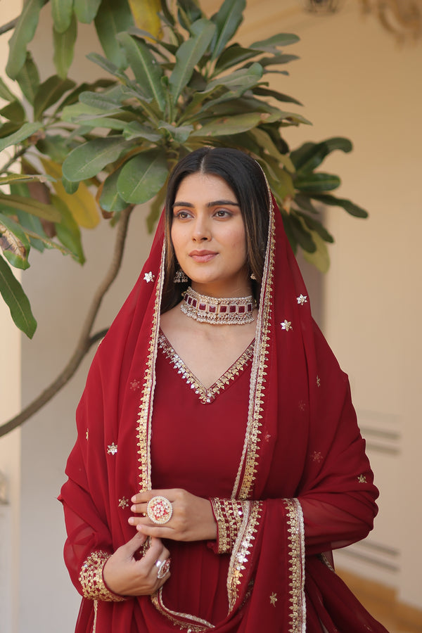 Maroon Faux Blooming Gown with Dupatta With Attractive Embroidered Sequins work.